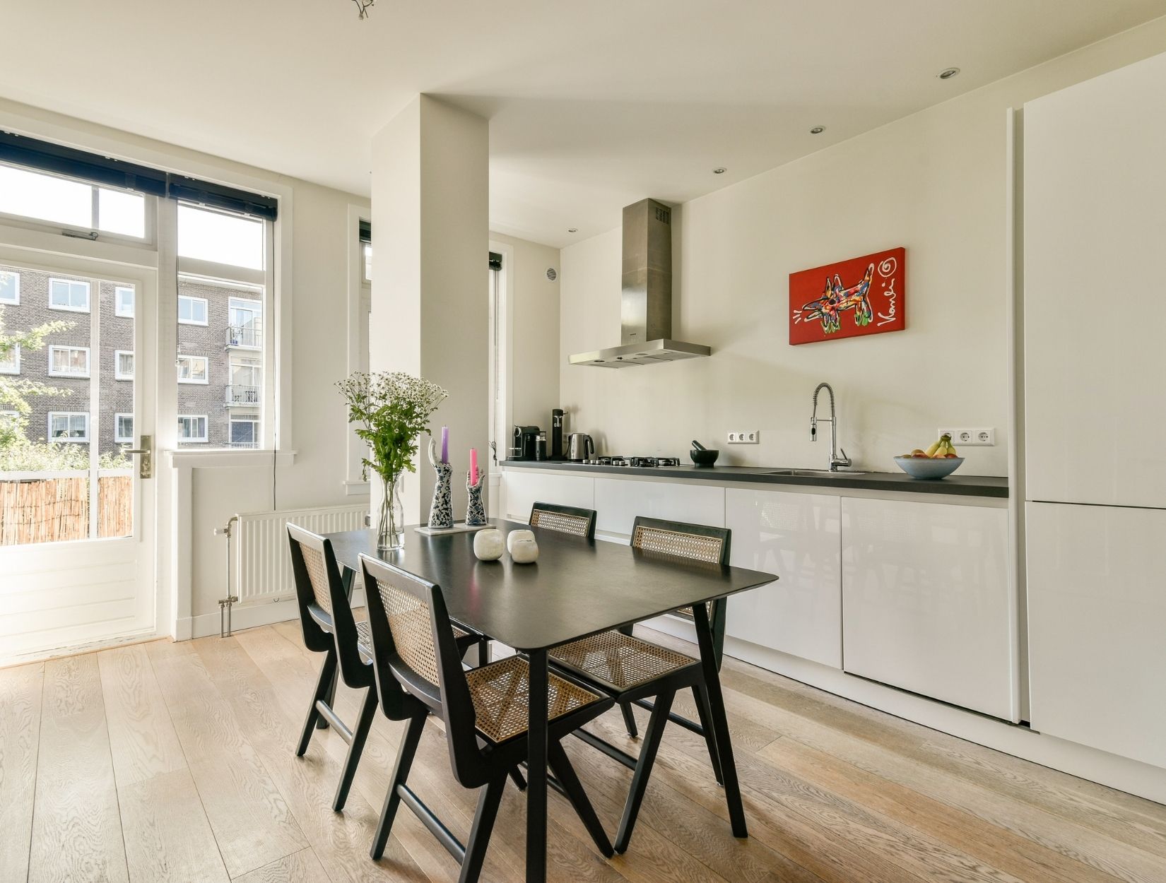 How do you clean under furniture and appliances?